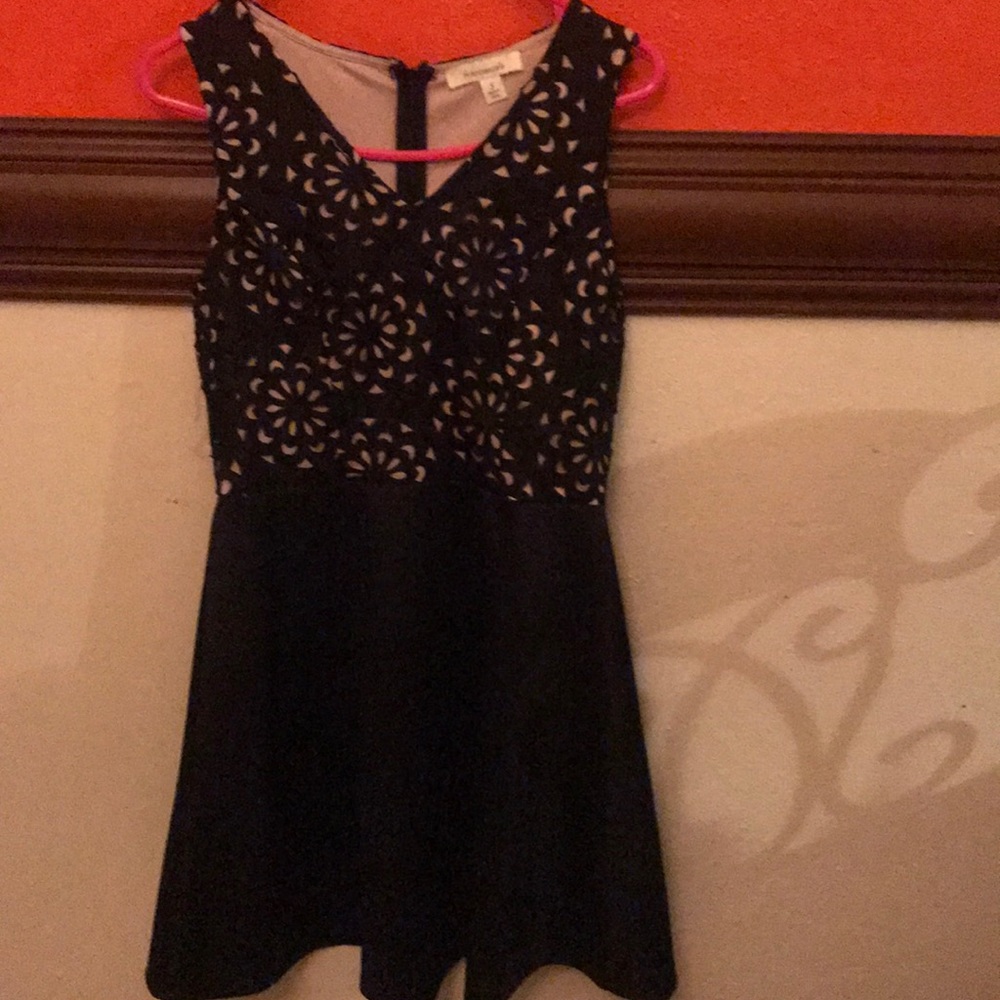 Sleeveless black and nude dress